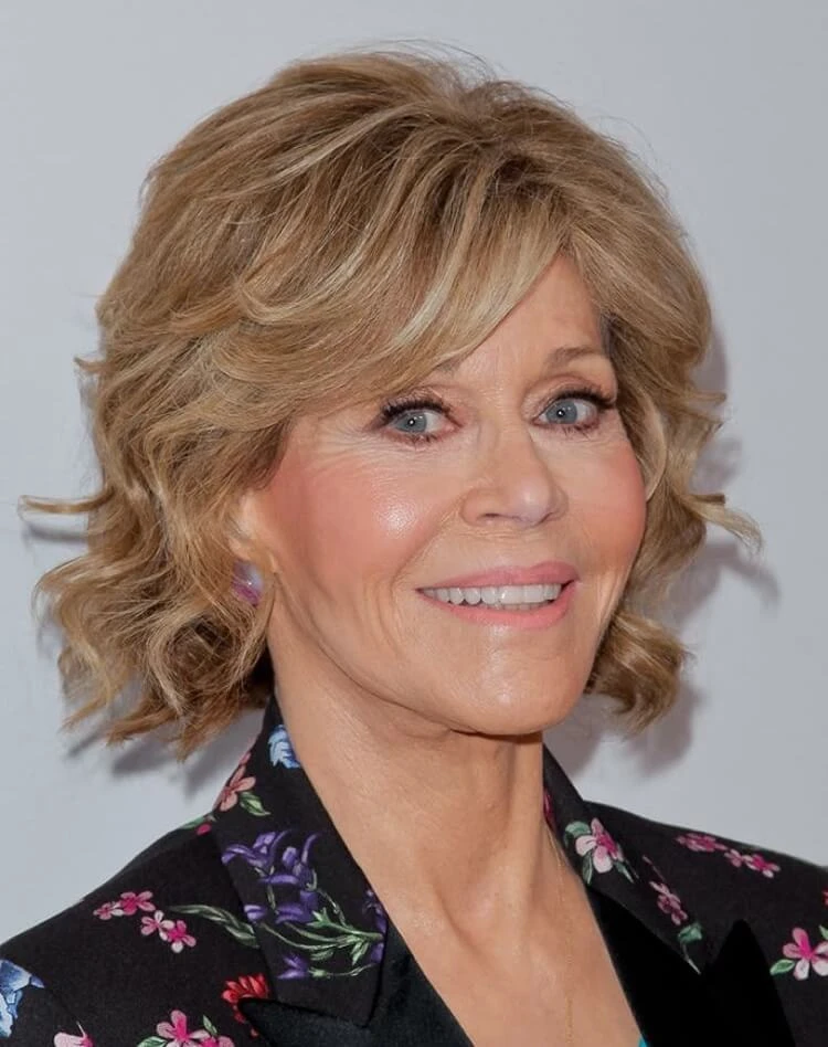 corte de pelo corto degradado mujer 50s pelo rizado flecos cortina Jane Fonda